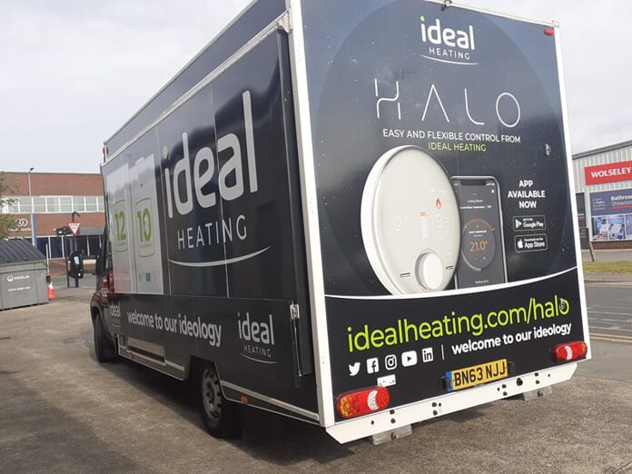 An image of a FASTSIGNS vehicle wrap on a truck